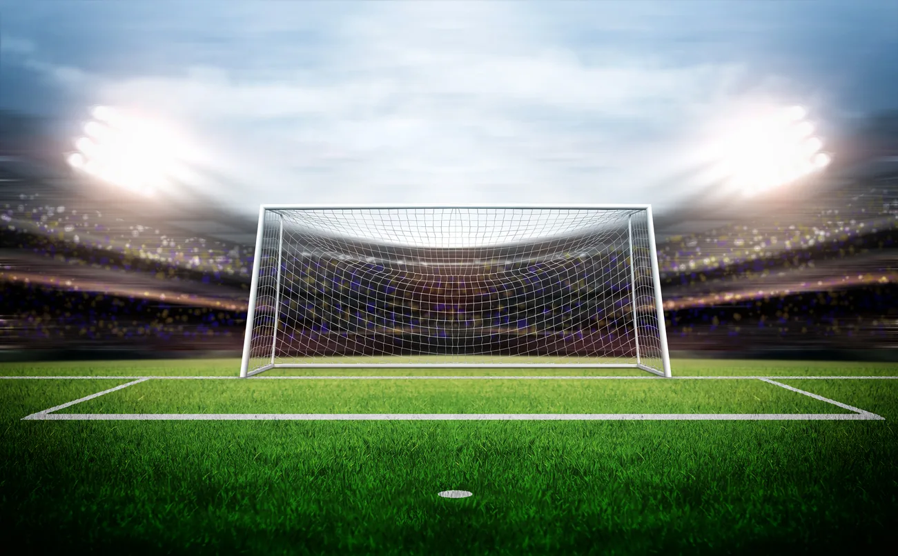 Imagem gráfica de campo de futebol com foco em trave.