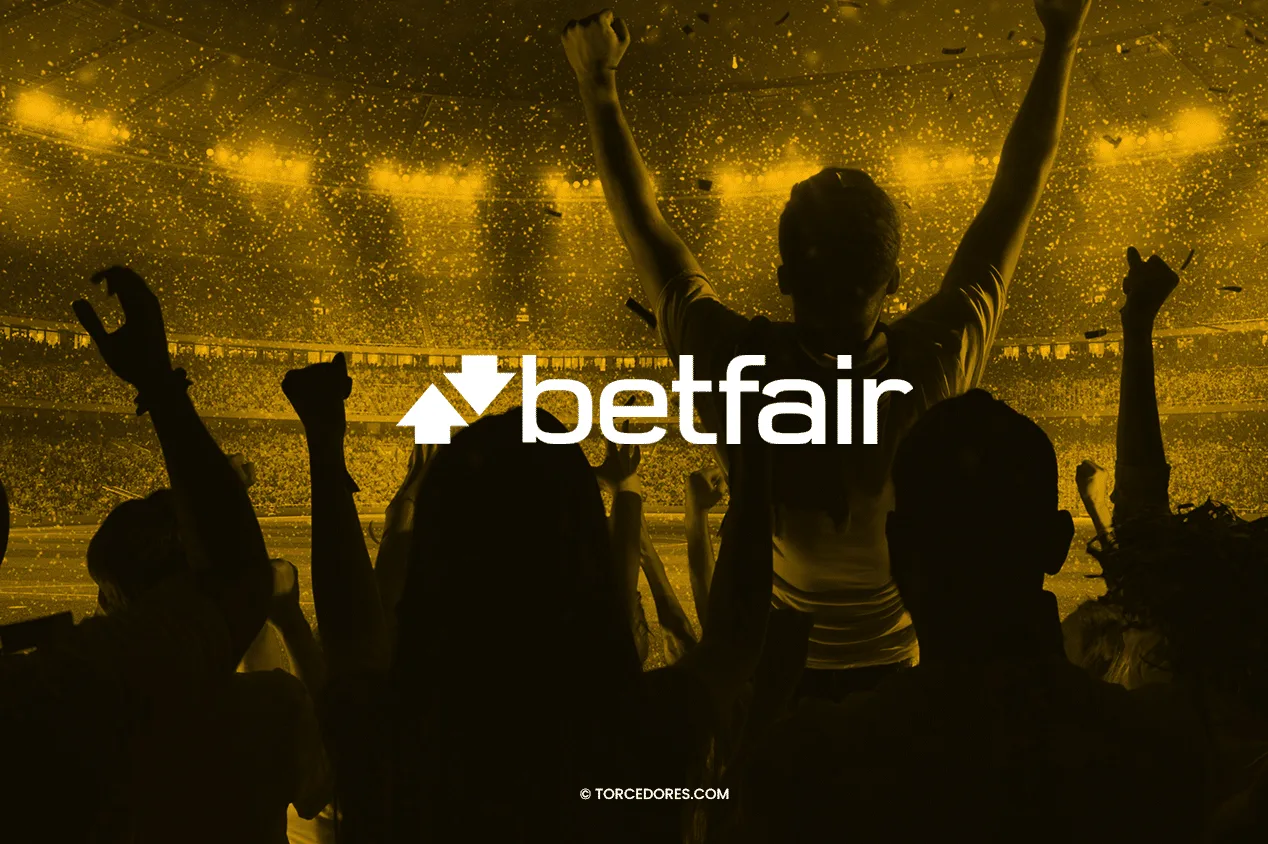 Imagem promocional Betfair em tons sépia: torcedores comemorando em estádio.