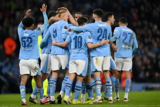 Jogadores do Manchester City comemoram o terceiro gol marcado contra o Copenhague pela Champions League