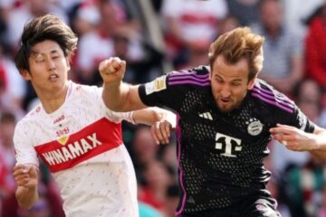 Jogador do Stuttgart disputa bola com Harry Kane, do Bayern de Munique