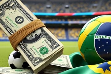 Notas de dólar, com bola de futebol e bandeira do Brasil